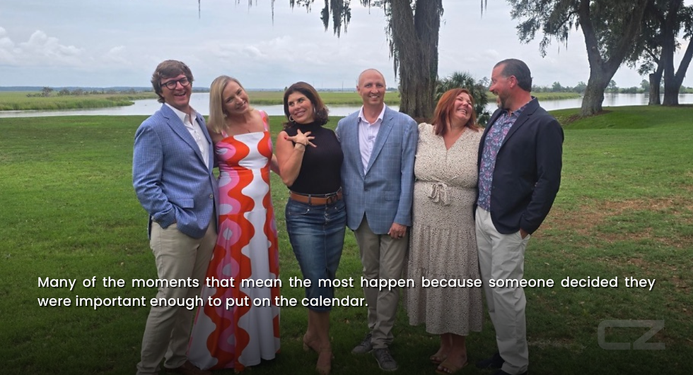 Six smiling adults pose on a lawn by a river and trees; quote reads Many of the moments that mean the most happen