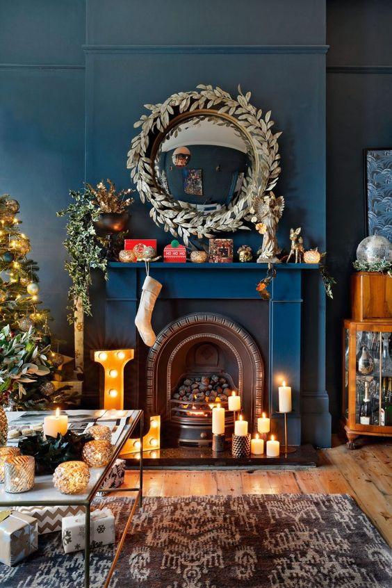 Cast iron fireplace insert with blue walls and candles