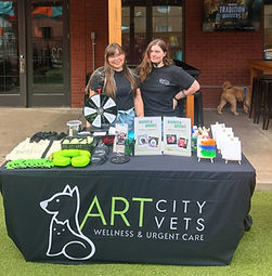 Two girls who work at Art City Vets during a community event