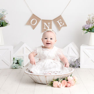 Happy baby at their first birthday Cake Smash Photoshoot