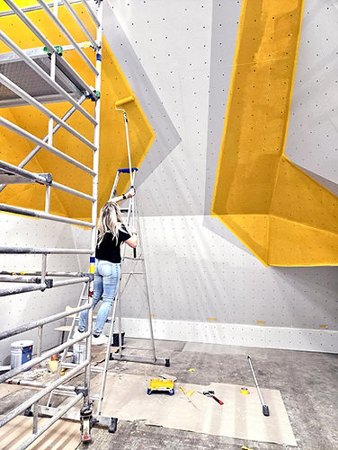 Painting the geometric wall graphics at Boulderverstas