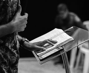 person standing while opening book on st