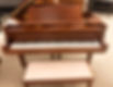 Mint condition Yamaha C3 Grand Piano in satin walnut with matching bench.