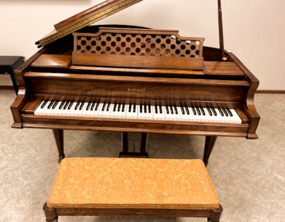Close-up view of Kimball grand piano keys and strings