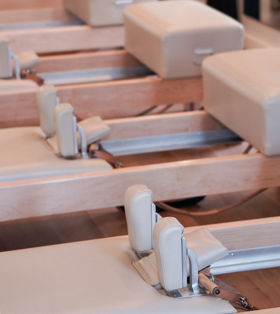 Eye-level view of Pilates Reformer machine in a bright studio