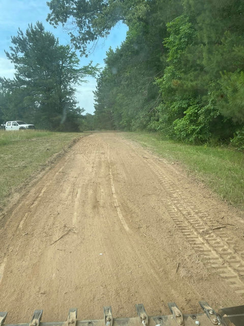 before gravel driveway installation uneven surface Fuquay-Varina NC