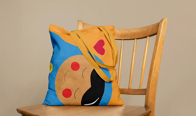 Free Canvas Bag on Chair Mockup.png