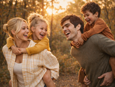 Relaxed outdoor family portrait in Stockport capturing natural smiles and candid moments at sunset.