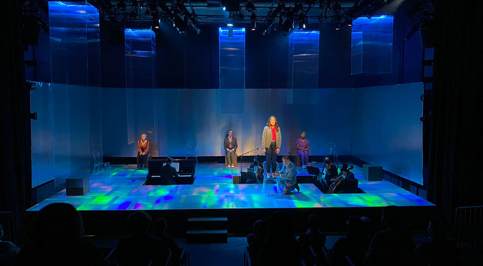 Set design of a room reflecting a rainbow prism by clifton chadick.