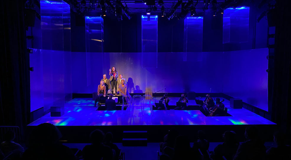 Set design of a room reflecting a rainbow prism by clifton chadick.