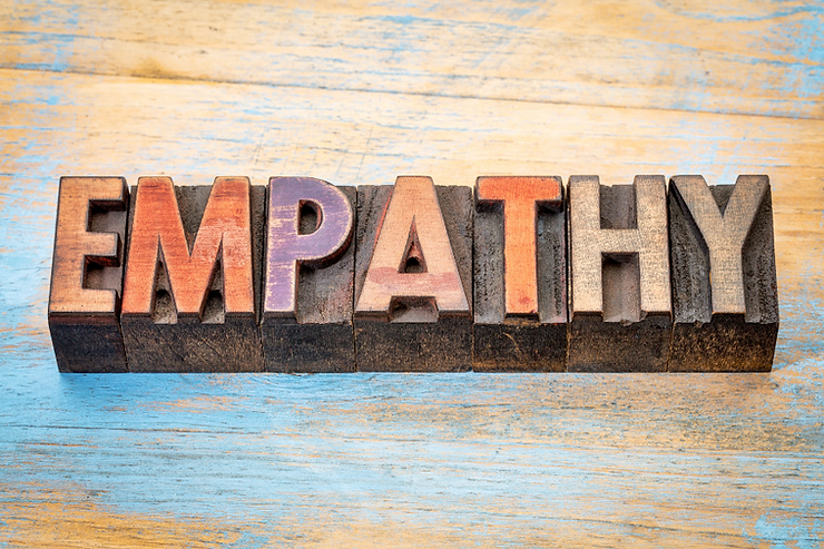 The word empathy spelled out in wooden blocks.