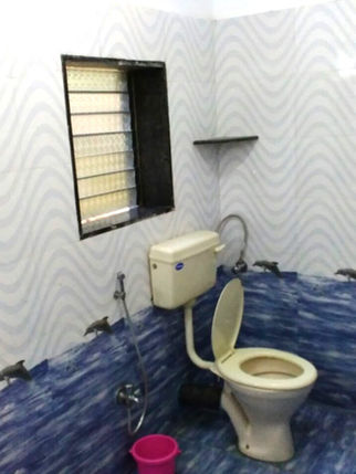 Clean bathroom with toilet and window