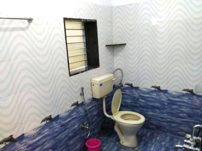 Clean bathroom with toilet and window