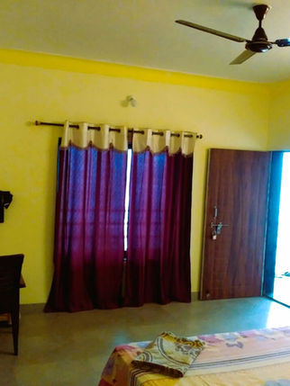 Devbag Malvan room with TV and curtains