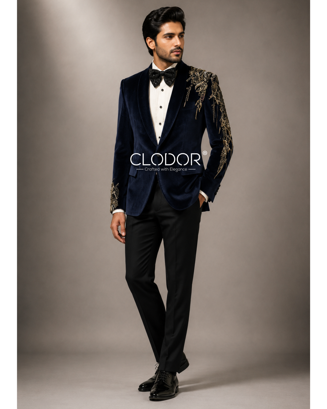 Full length blue velvet tuxedo with off-white shirt and black trousers – bespoke menswear by Clodor