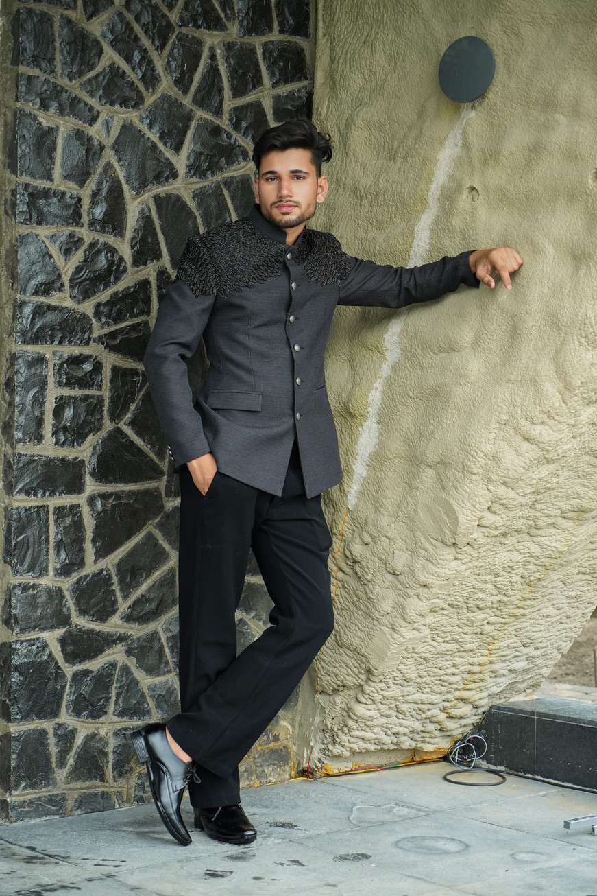 Heavy cutdana hand embroidery highlighted across shoulders of black handloom bandhgala – Clodor