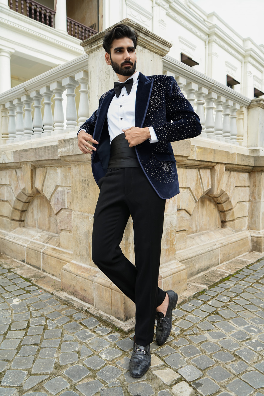 Full length midnight blue velvet tuxedo with pintuck shirt black bow tie and cummerbund – bespoke menswear by Clodor