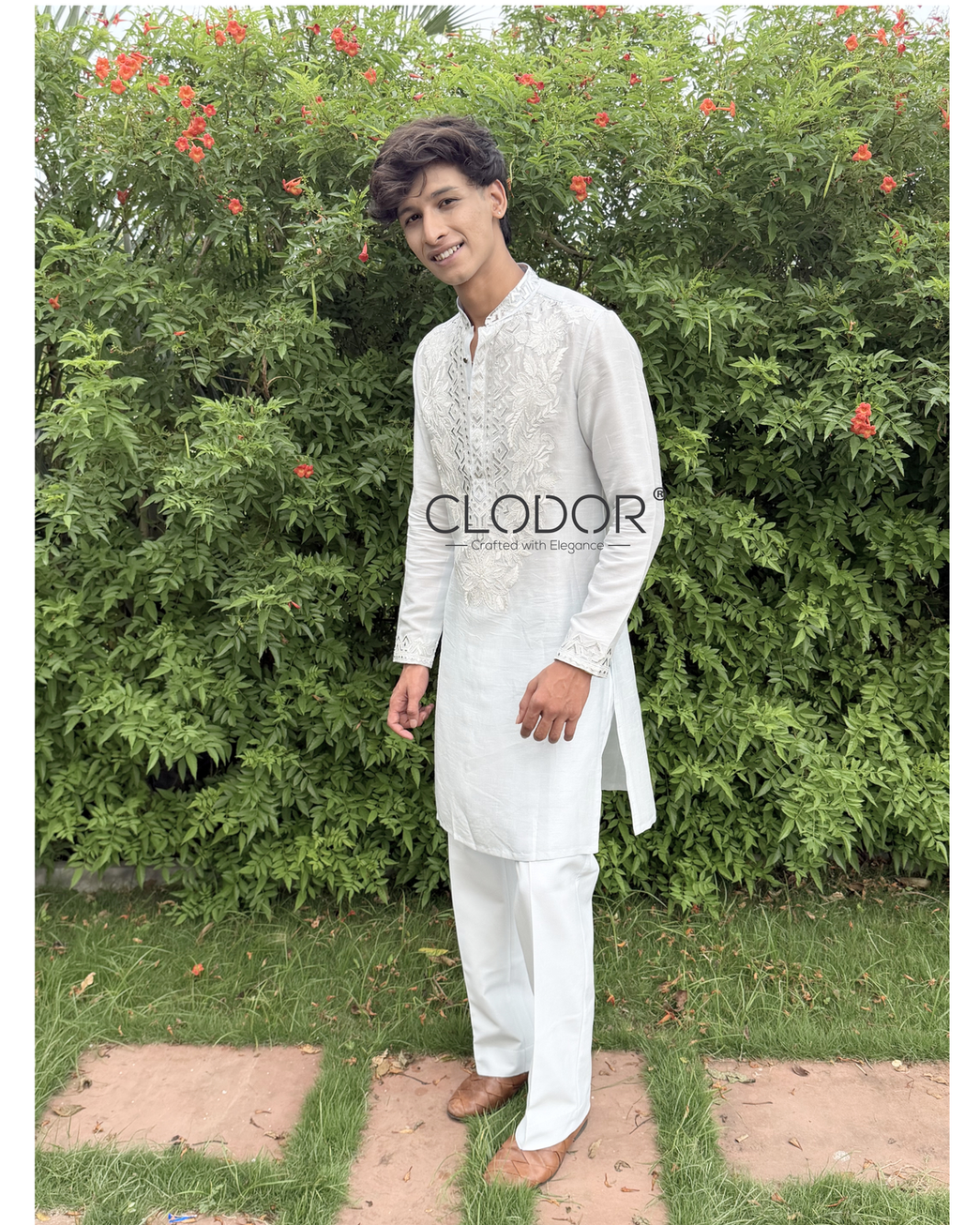 Luxury Light Blue Embroidered Kurta Set featuring intricate embroidery on the front, neckline, and sleeve cuffs.