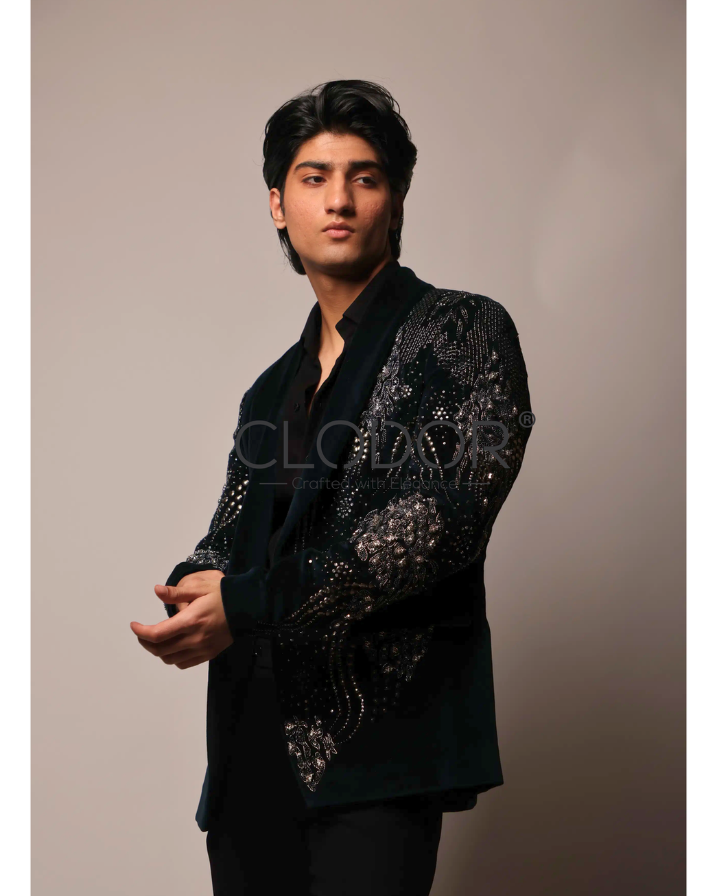 Heavy metal-based hand embroidery with elephant motifs on teal cotton velvet tuxedo