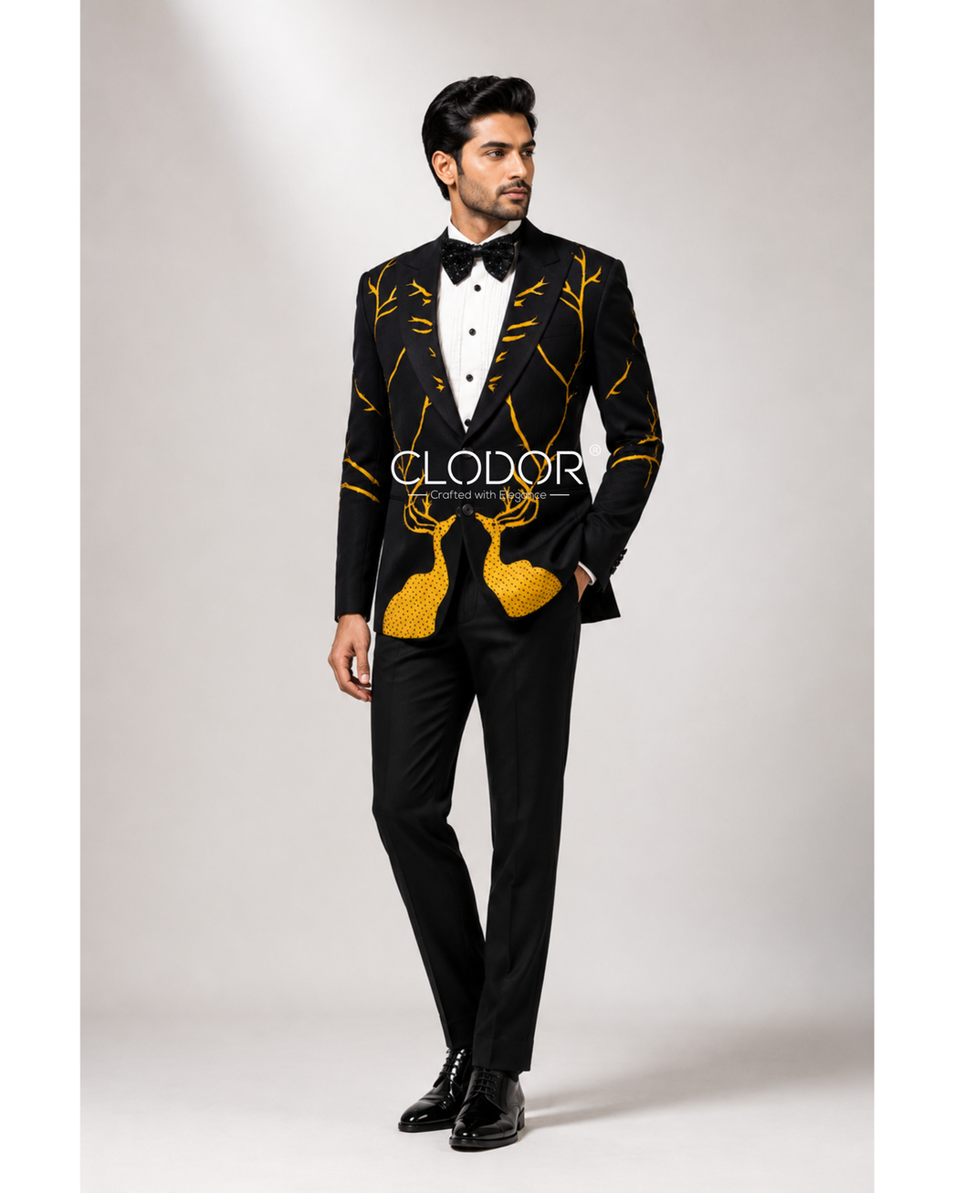 Full length black tuxedo with white pintucks shirt and black trousers – bespoke menswear by Clodor