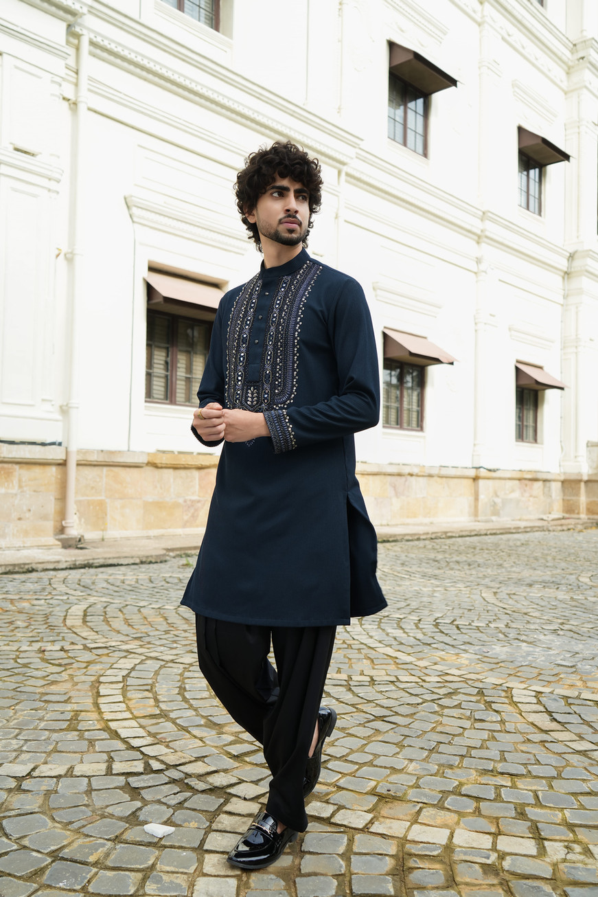Intricate hand embroidery on neckline of teal striped shimmer kurta