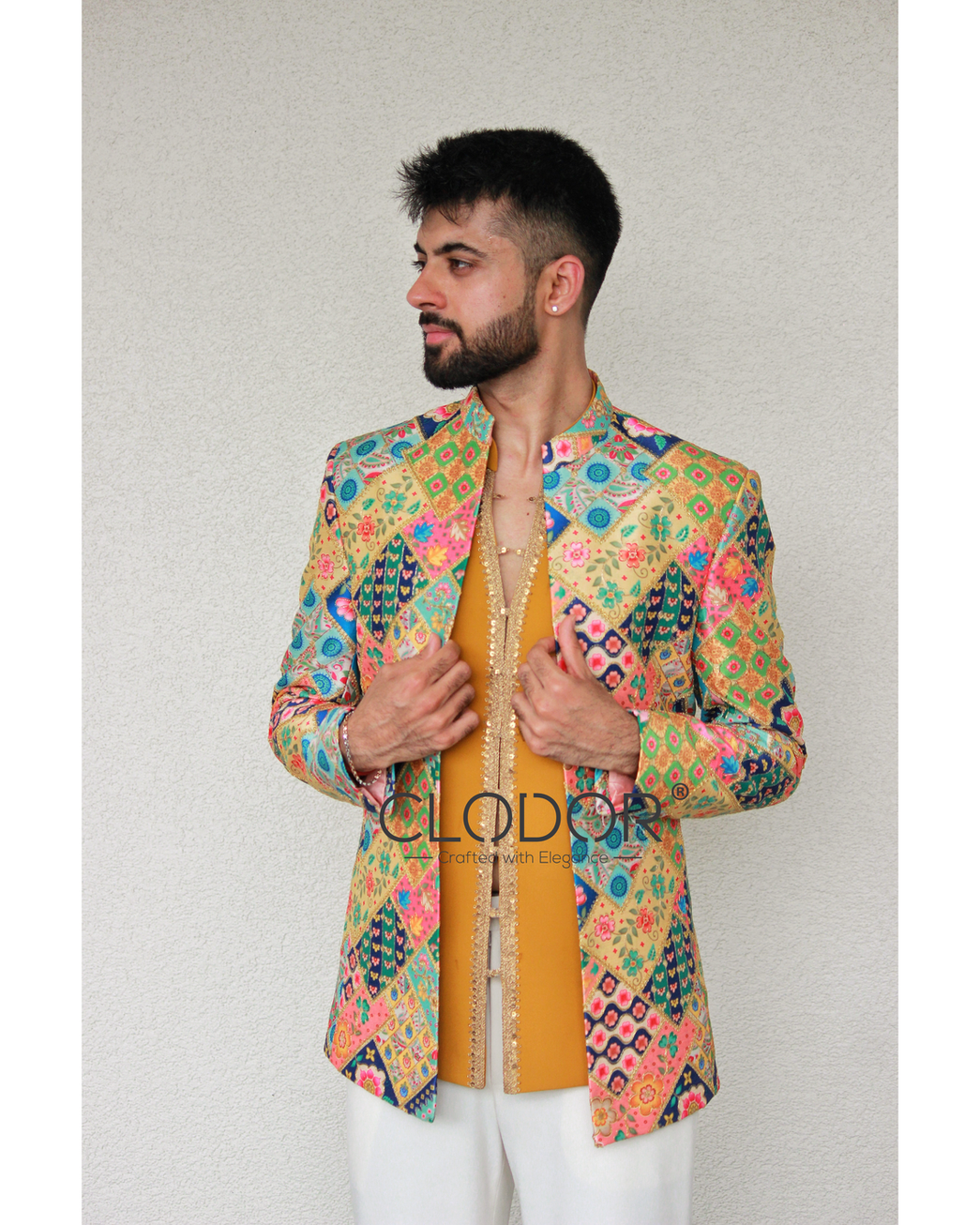 2. Side view multicolor shrug groomsmen outfit featuring embroidered raw silk layering and festive detailing — bespoke by Clo