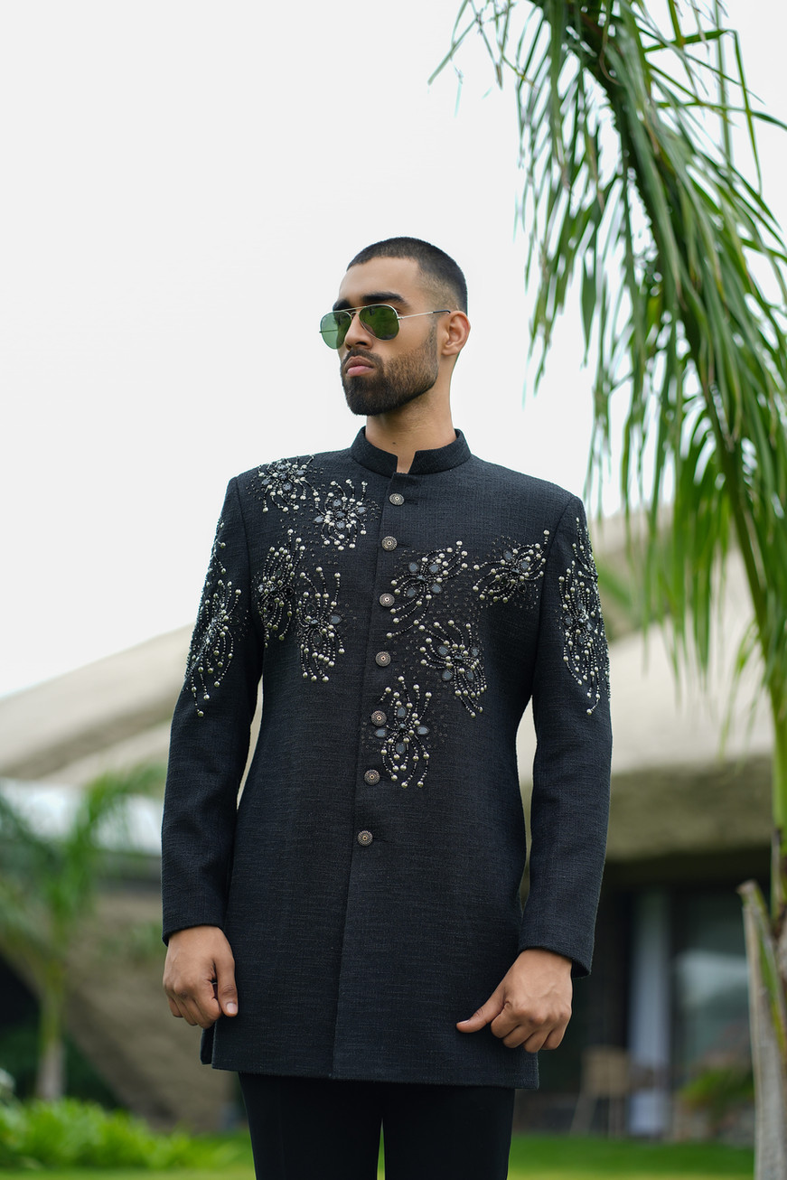 Detailed hand embroidery artwork across front and sleeves of black handloom textured achkan – Clodor