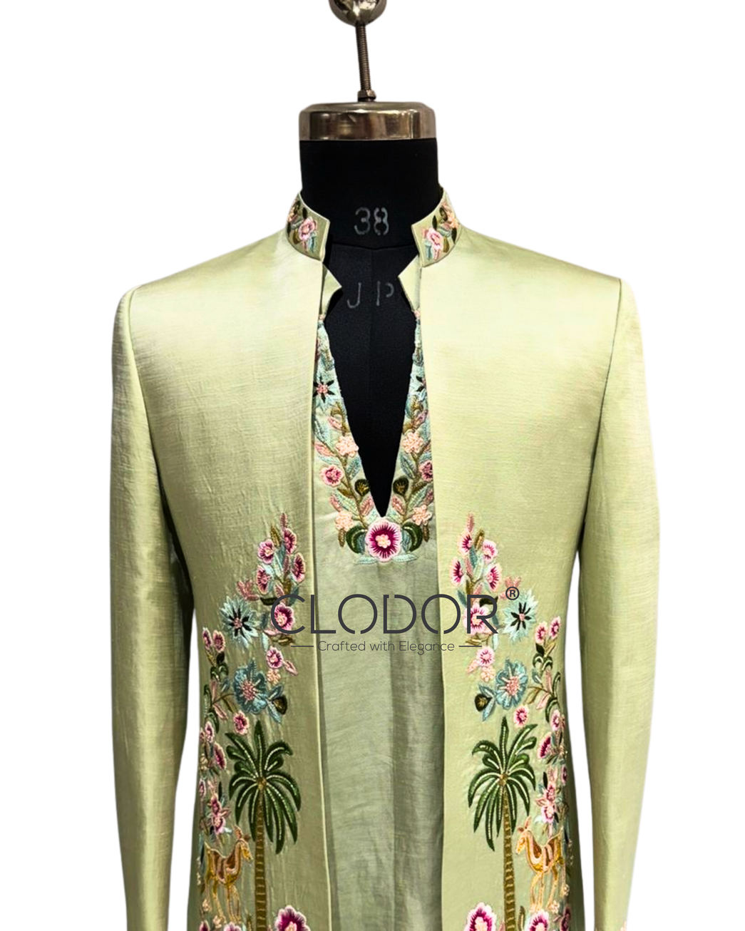 Hand-embroidered light green linen satin shrug featuring floral and nature-inspired motifs