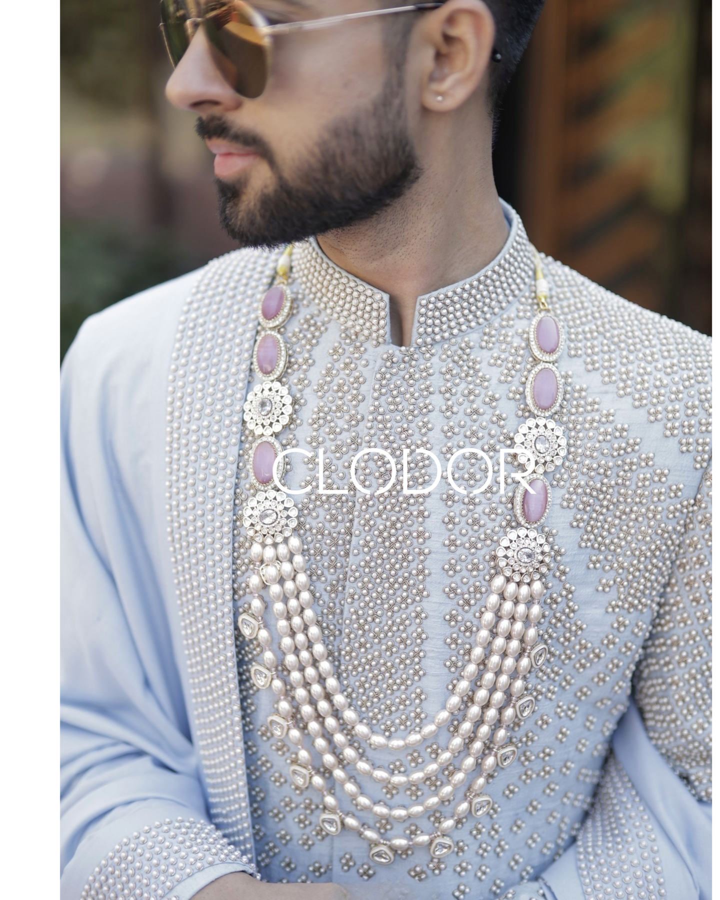 Heavy dabka and pearl hand embroidery on front of powder blue dupion silk sherwani