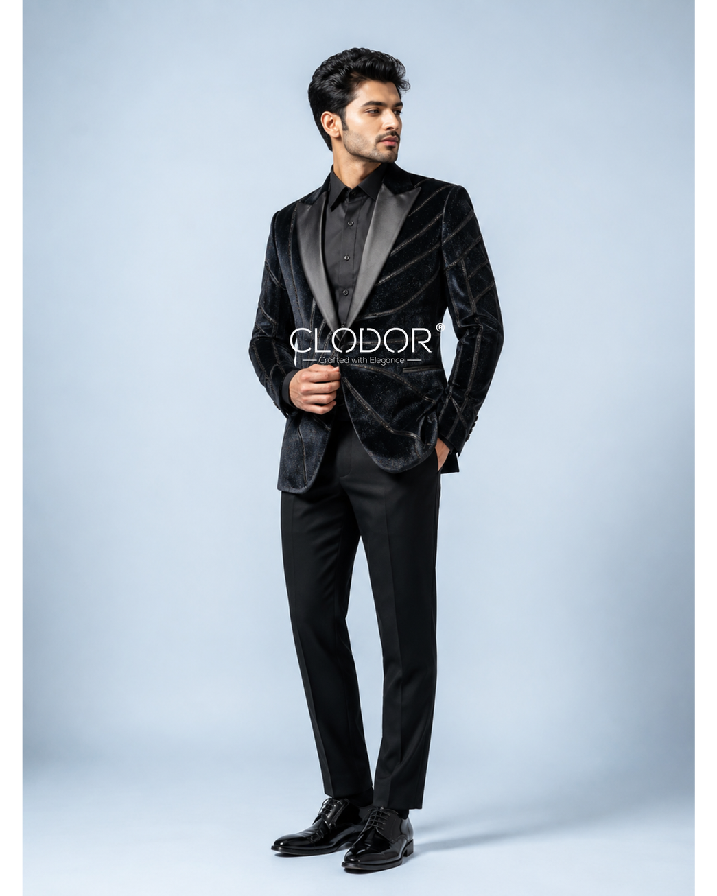 Intricate hand painting combined with detailed hand embroidery, creating a sculptural artistic pattern across the tuxedo