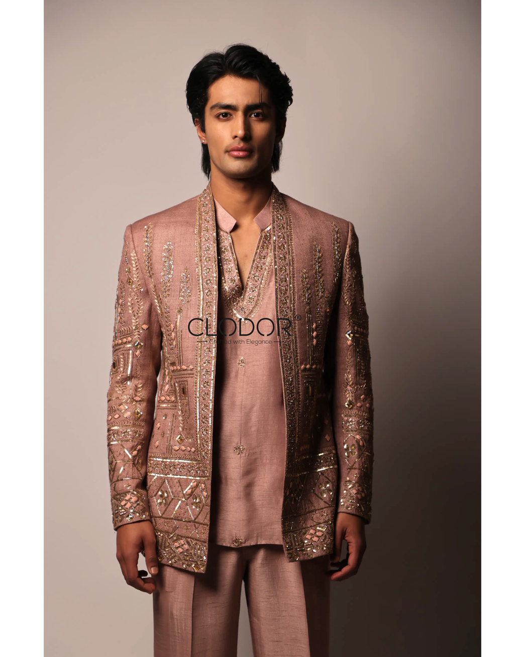 V-cut neck kurta in rose gold silk layered under embroidered shrug
