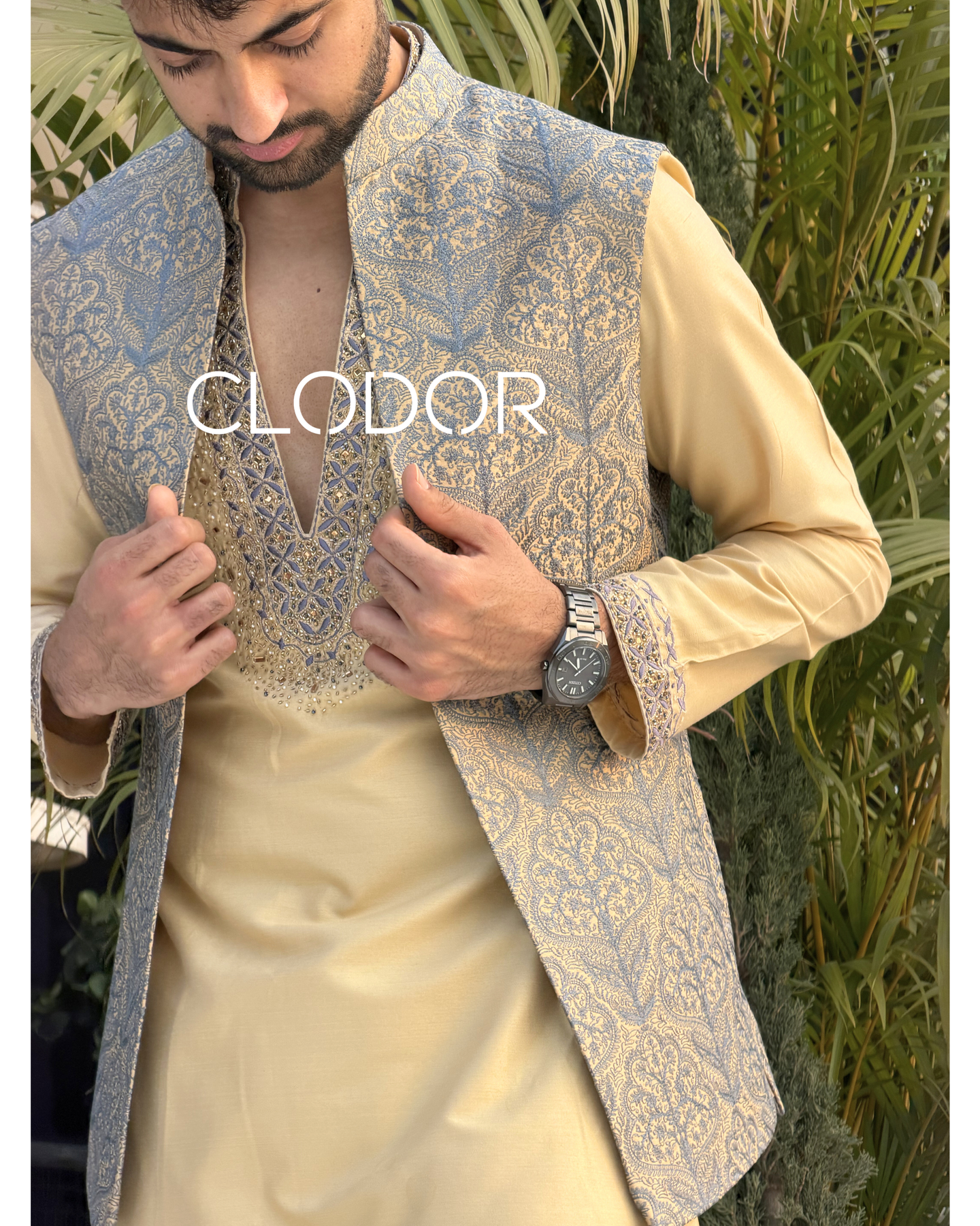 Hand embroidery on V-cut neckline of golden silk kurta – bespoke menswear by Clodor