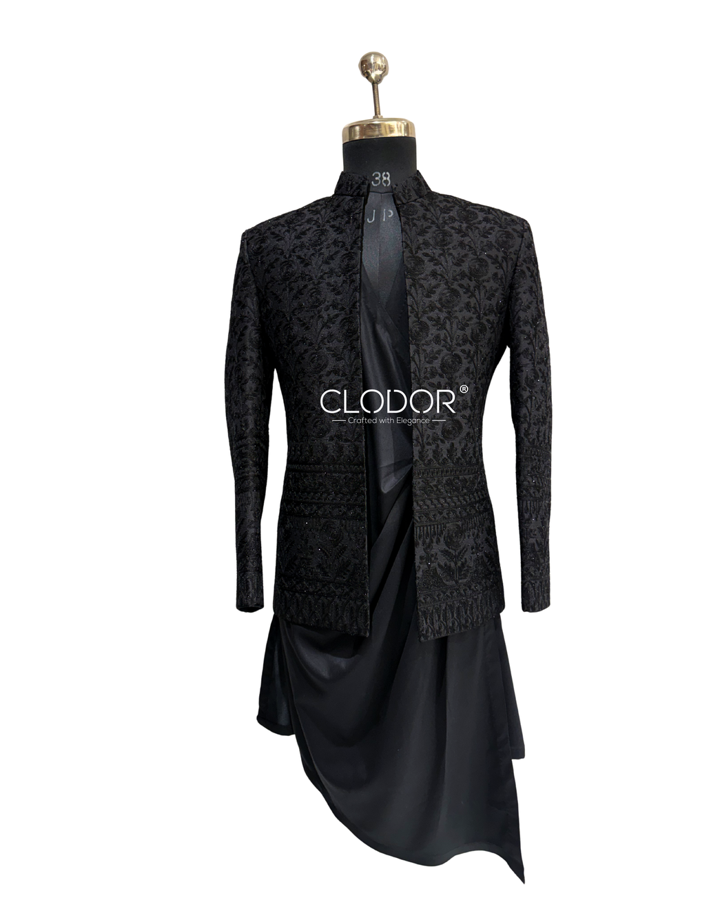 Close-up of the black embroidered silk shrug featuring intricate all-over floral and geometric embroidery.