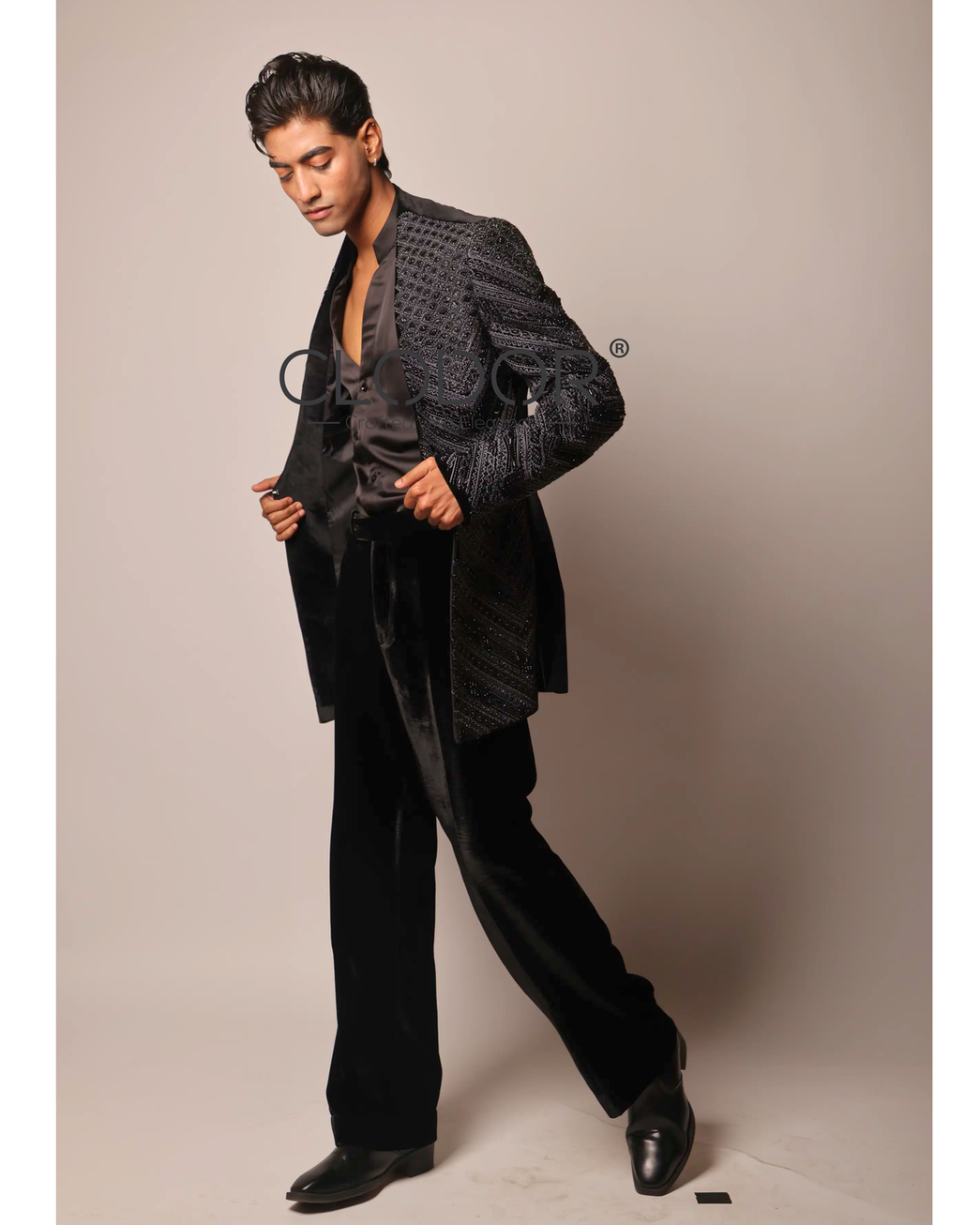 Sleek satin V-neck shirt layered under Noir Chevron Velvet Shrug Ensemble – Clodor
