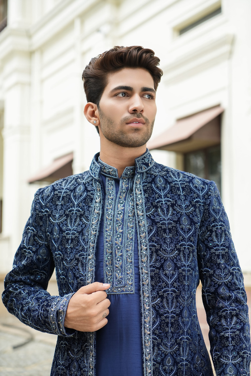 Pearl dabka and zari hand embroidery detail on blue velvet embroidered shrug