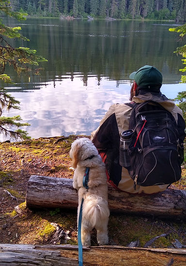 Derrick and his dog Pooka trying to overcome decision paralysis while looking out over a lake.