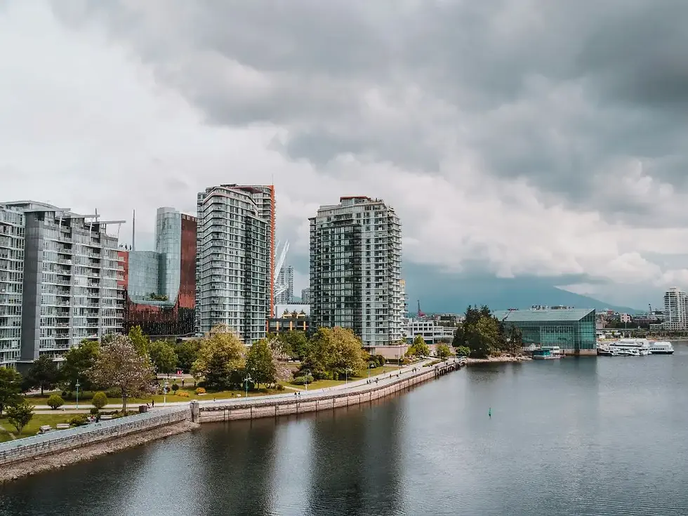 A view of the cloudy Vancouver skyline, illustrating how UVA rays penetrate grey clouds to cause age spots.