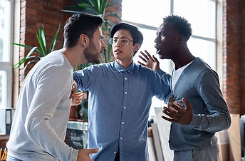 Participants practicing communication and de-escalation techniques during conflict management training.
