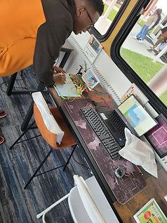 A young man learns how to build a diy gaming console from a Makey Makey