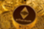 Ethereum coin on a pile of gold cryptocurrency coins. Coins feature intricate circuit patterns, creating a tech-inspired, golden backdrop.