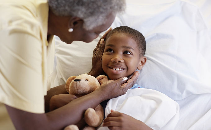 Smiling boy in bed