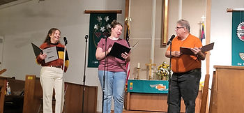 Anna Fitzmaurice, Rose Coates, and John Cusamano rehearsing for UpStage Artists FREE production of It's A Wonderful Life: A Live Radio Show on December 7 at 7 pm at Emmanuel United Methodist Church in Beltsville.