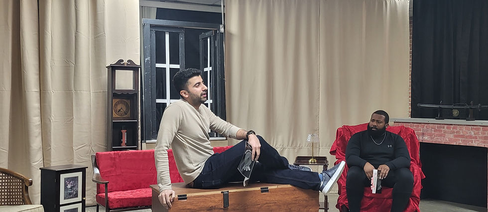 Vedant Sharma as Wyndam Brandon (Center) and Joseph Battley II as Charles Granillo (right) discuss the “perfect murder” in UpStage Artists production of Rope opening February 21st at Emmanuel United Methodist Church, 11416 Cedar Lane, Beltsville, MD 20705.