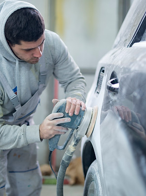 shot-of-professional-repairman-preparing-vehicle-for-new-paint.jpg