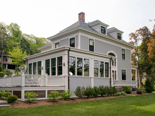 Victorian home with addition and deck. 