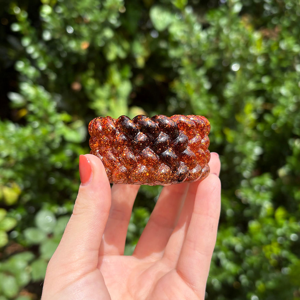 Artistic black and orange swirl resin candle holder with glitter