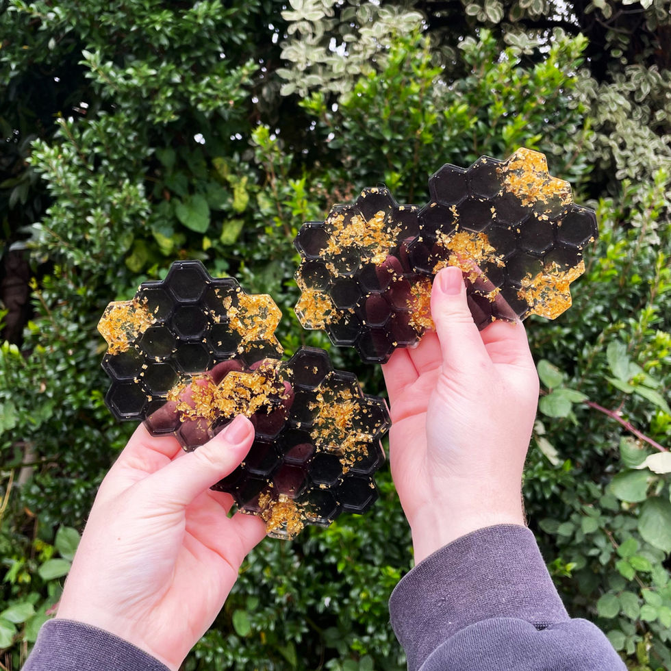 Black and transparent honeycomb resin coaster set with gold leaf