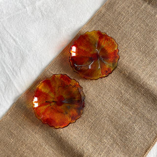 Translucent orange resin dish with subtle marbling