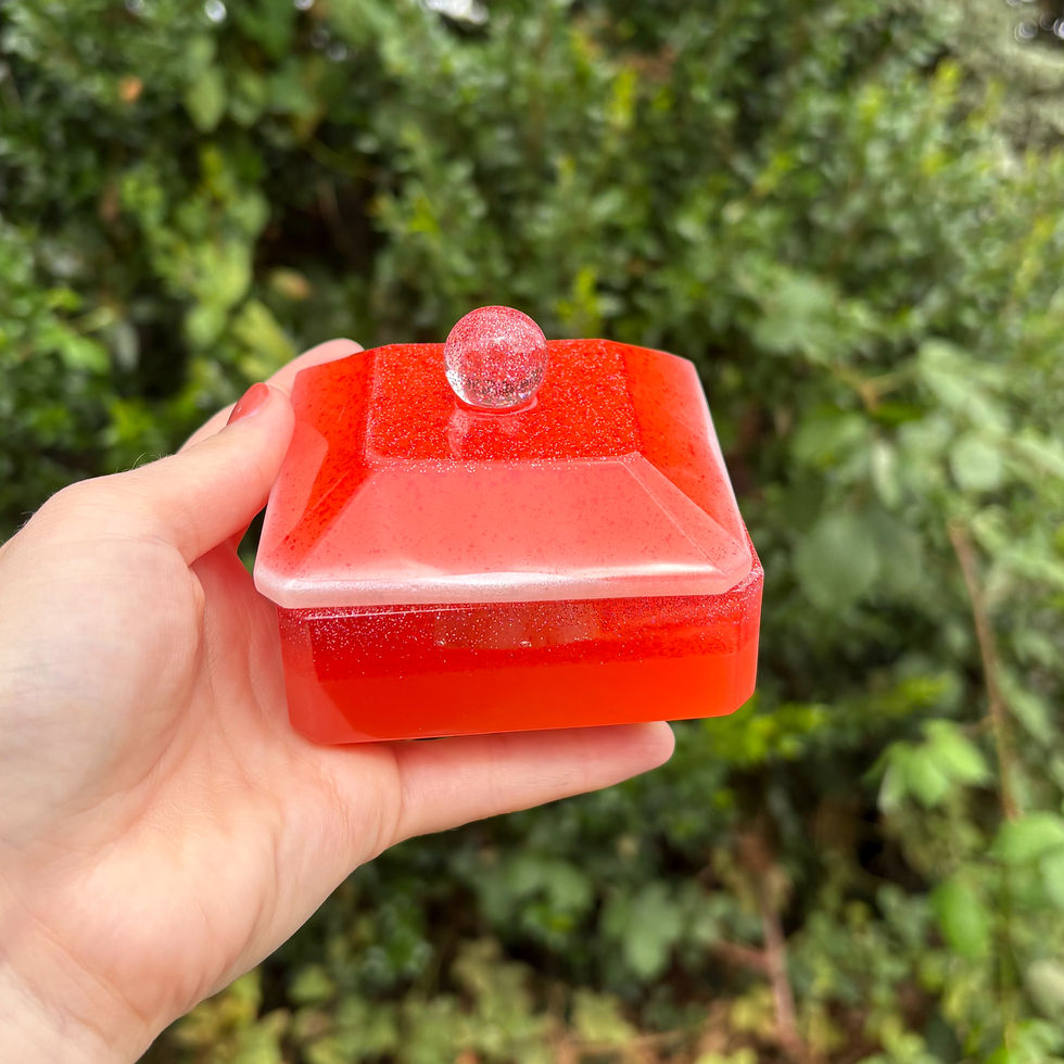 Orange resin storage pot with white highlights and glitter