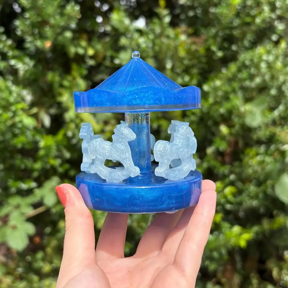 Handmade dark blue resin carousel with translucent blue horses